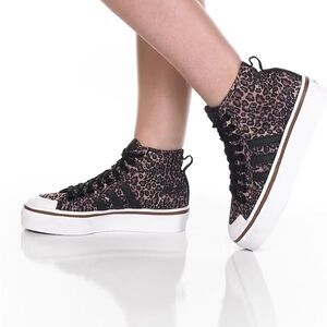 Mid top women’s Adidas animal print platform sneakers
